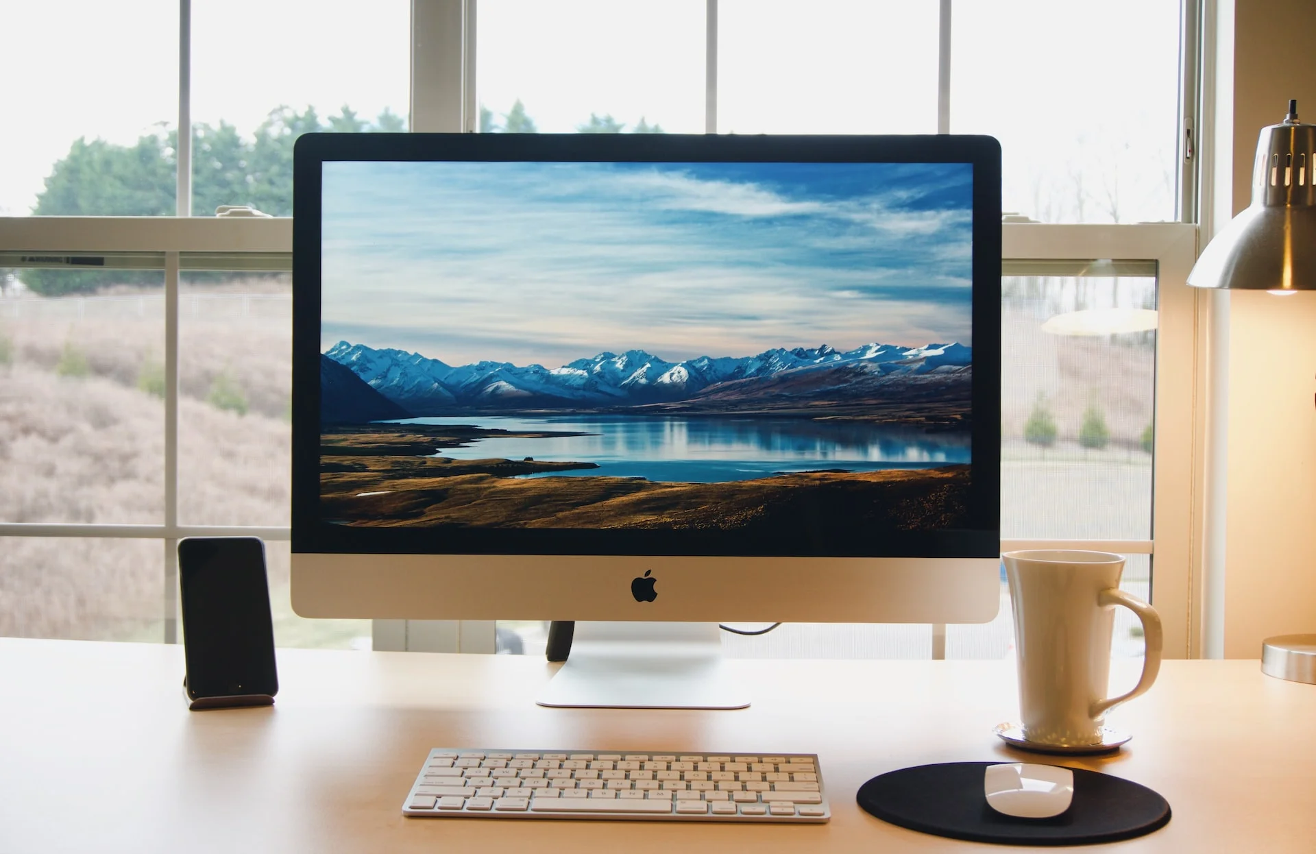 A clean, minimalistic work desk with a computer