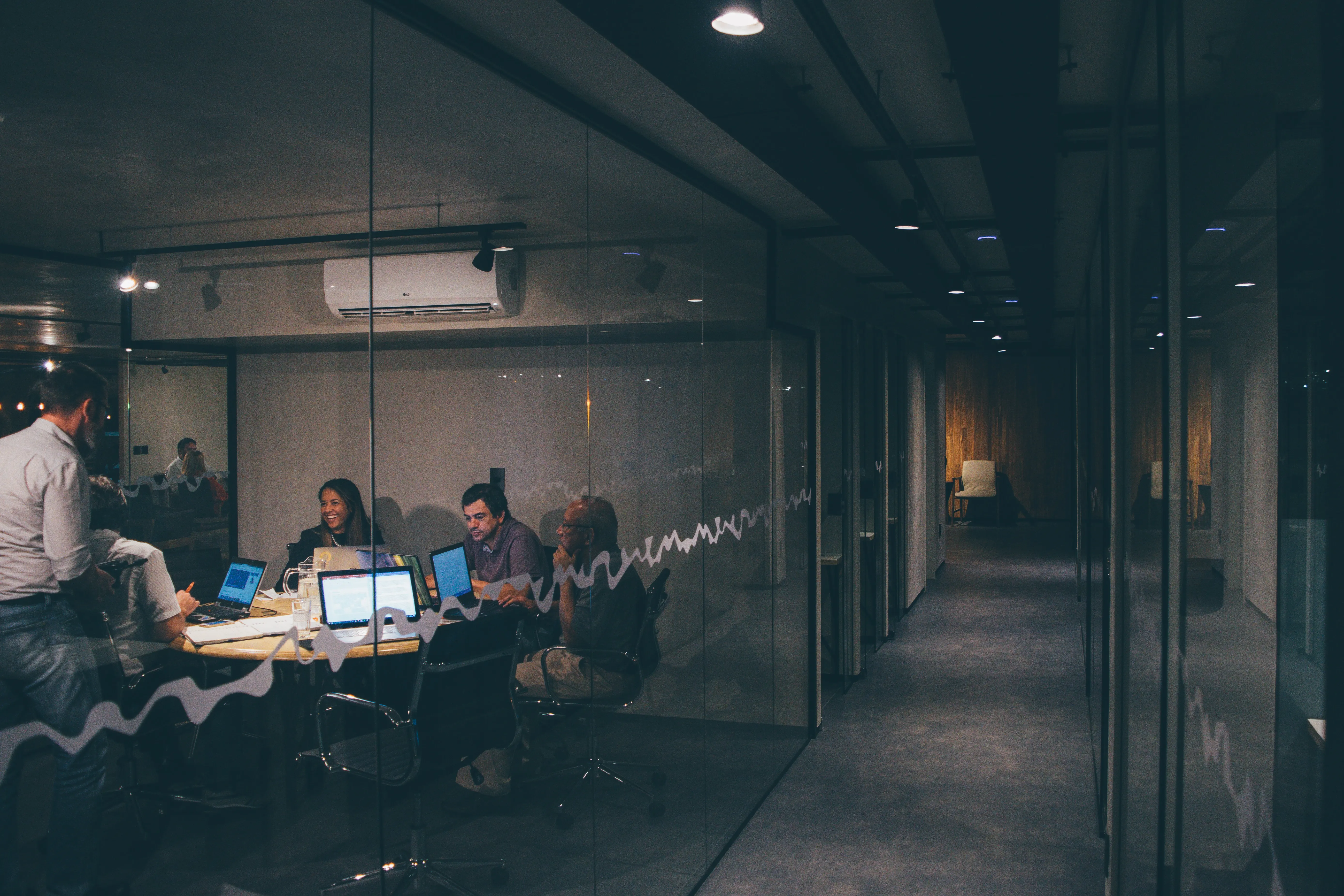 A group of people having a meeting photo