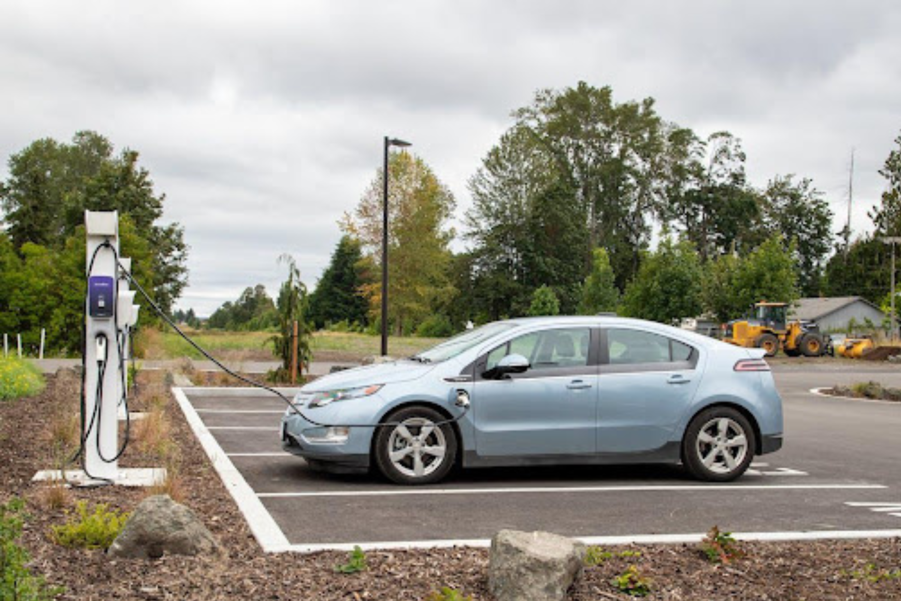 A car plugged into an electric charger