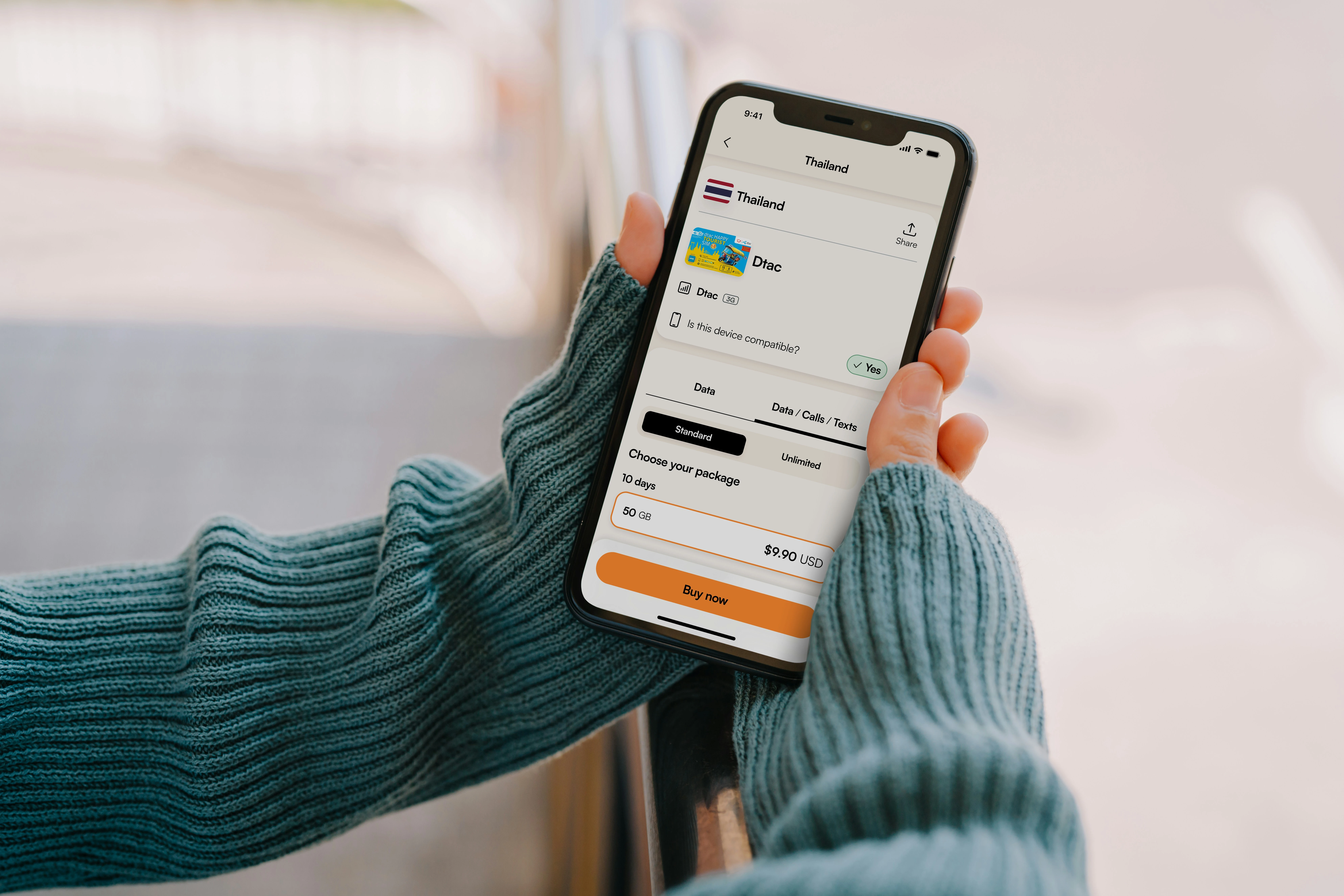 Woman's hands holding an android phone.